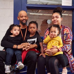 Parents with their 3 young children at city rescue mission