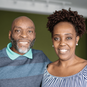 Couple, Scott and Deanna standing side by side smiling as they share their city rescue mission experience